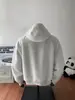 Sudadera con medio cierre y cuello alto en color blanco y gris para hombre, sudadera con capucha de peso pesado de retazos deconstruidos para otoño, ropa exterior de corte limpio para hombre