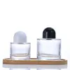 Botella de perfume cilíndrica de vidrio transparente botella secundaria de perfume botella con pulverizador de presión de alta gama portátil muestra cosmética botella vacía