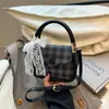 Bolsa de Mano Popular a Cuadros Transfronteriza para Mujer 2025 Nuevo Estilo de Moda Bolso Cuadrado Pequeño Bolso Cruzado Versátil de Gama Alta