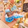 Llavero de botella flotante para velero marino con aceite en su interior, exquisitos adornos para mochila escolar infantil, llavero para llaves de coche, colgante para pareja