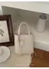 Bolso de diseñador único para mujer, nuevo bolso cruzado versátil de verano 2026, bolso de mano súper popular para ir al trabajo, bolso cuadrado pequeño