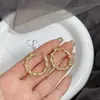 Pendientes geométricos irregulares de círculo exquisito de Europa y Estados Unidos, moda, temperamento, tendencia, Joker, transfronterizo, celebridad de Internet, con joyería para el oído