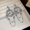 Aretes de aguja de plata con diamantes, borlas de mariposa de perla hueca, aretes de lujo ligero de alta gama, aretes de diseño único de nicho para mujer