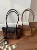 Elegante bolsa de mano de gran capacidad estilo francés para principios de otoño 2026, bolso de hombro de nicho, alta costura, elegante, bolsa ligera para el hombro