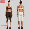 Conjunto de ropa de yoga transfronterizo con hermoso cuello halter en la espalda, sujetador deportivo de color contrastante, pantalones capri deportivos para correr al aire libre, conjunto de fitness