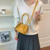 Bolso tote pequeño retro translúcido transfronterizo con charm dulce, bolso cruzado para mujer, bolso cuadrado pequeño de mano casual, bolso de hombro