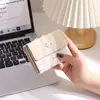 2026 Versão Coreana Novo Estilo Estampada Fresca e Simples Dobrável 70% de Desconto Presilha de Ferro Carteira Curta Multifuncional Nicho Carteira Feminina