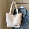 A Bolsa Sacola Casual e Simples Popular Deste Ano para Sala de Aula de Estudantes é uma Bolsa de Ombro Leve da Moda de Grande Capacidade Estilo Executivo para Mulheres