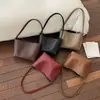 Bolso de axila texturizado vintage estilo francés para mujer, verano 2026 moderno casual tejido versátil elegante bolso de hombro