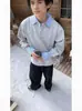 Suéteres de cuello camisero de dos piezas falsas con costuras de color en contraste para hombres y mujeres, otoño, manga larga, solapa, holgados, diseño para enamorados, sentido del diseño, top