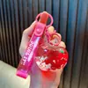 Llavero de fruta relleno de aceite, lindo colgante de bolsa de botella de arena líquida, llavero de coche, pequeños regalos para máquinas expendedoras, al por mayor