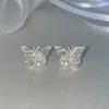 Exquisitos aretes de perla de temperamento de alta gama de nicho para mujer, dulces aretes de mariposa estilo pequeño Chanel, estilo minimalista, exquisita joyería para orejas