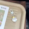 Chaveiro fofo de desenho animado de foca adorável, bolinho de pudim, charme feminino para mochilas de estudantes, presente para melhores amigos