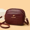Bolsa Pequena Redonda de Couro Macio Texturizado Transfronteiriça para Mulheres 2025 Nova Moda Padrão de Pedra Três Camadas Grande Capacidade Bolsa de Ombro Único Transversal