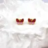 Pendientes de Mariposa Novedosos y de Moda en Acero de Titanio con Goteo de Aceite para Mujer, Pendientes Pequeños de Acero Inoxidable de Alta Gama Estilo Chanel al por Mayor