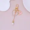 Mini Bolso Colgante Llavero Perla Amor Borla Colgante Niña Funda de Auriculares Decoración Accesorios DIY