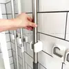 Nuevo clip de pared para mopa, gancho sin taladro para pared de baño, estante de almacenamiento para escobas, soporte para mopa