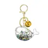 Llavero con Arena Líquida en Botella de Aceite, Botella que Brilla en la Oscuridad, Llavero de Ballena, Colgante Exquisito para Bolso, Lindo Accesorio para Llavero