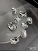 Joyería para decoración de uñas K9 blanca transparente flash con base de punta taladro taladro de forma especial pila de taladro accesorios para uñas al por mayor