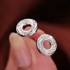 Pendientes de aro pequeño de metal transfronterizos diseño espiral cóncavo-convexo personalizado joyería de aguja de plata 925 pendientes de nicho para mujer