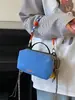 Venta al por mayor transfronteriza de bolsos pequeños de tela de mano casuales simples para exteriores, bolsos cuadrados de nicho con bloques de color para commuting, bolsos de hombro y cruzados