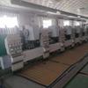 Dongguan Máquina de bordado acolchado de segunda mano máquina todo en uno de bordado perforado máquina perforadora de cuero bordado multijefe venta al por mayor