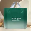 Bolsa de plástico al por mayor de fábrica, bolso de tienda de ropa, bolso de tienda de ropa para mujeres y niños, bolsa de regalo, bolsa de embalaje engrosada
