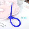 Venta al por mayor de fabricantes de bridas de datos multifuncionales con diseño de hebilla tipo pasador reutilizable para cables de red, hechas de silicona