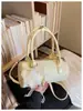 Bolsa Redonda Cilíndrica Portátil de Nicho Coreana Feminina Verão 2026 Nova Tendência Bolsa de Boliche Textura de Alto Padrão Bolsa de Ombro Único Transversal