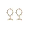 Pendientes de cola de pez con incrustaciones de diamantes y círculos huecos de estilo coreano con aguja de plata 925. Pendientes de delfín de sirena Ji de moda popular en Internet.
