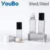 Botella dispensadora de aceite de ricino de vidrio transparente de 30 ml y 50 ml Botella con rodillo de jade de cristal rosa natural Botella con rodillo de cuarzo rosa