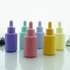 Botella cuentagotas de vidrio con cabeza de silicona color macarrón botella de muestra para viaje subempaque botella cosmética vacía botella para líquidos botella de esencia