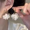 Pendientes de flores de hadas súper, pendientes femeninos de estilo coreano, temperamento de moda, diseño de nicho, versátiles, dulces, combinables, nuevos pendientes
