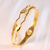 Pulsera de Acero de Titanio de Trébol de Cuatro Hojas para Mujer, Acero Inoxidable, Color Dorado, Números Romanos, Lujo Ligero Europeo y Americano, No se Desvanece, Venta al por Mayor Directa del Fabricante