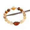 Pulsera de Cristal Súper Siete Tesoros Múltiples Negro Dorado Natural con Cuentas para Niñas Lujo Ligero Alta Gama Pulsera de Cristal Torre Amarilla Estilo Popular Venta al por Mayor