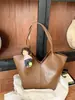 Bolso tipo cesta de mercado de moda estilo coreano 2025 nuevo versátil con patrón de lichi bolso de mano de alta gama de un solo hombro cruzado