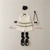 Ropa Infantil en Stock 26 Verano Nuevo Estilo Niñas Pequeñas Estilo Coreano Lunares Encaje Tira Volantes Conjunto de Shorts Conjunto de Dos Piezas