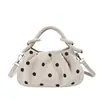 Bolso de lunares para debajo del brazo para mujer, nuevo bolso de mano chic estilo coreano de nicho para el otoño de 2026, bolso de hombro moderno para el trabajo y los desplazamientos