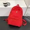 Mochila Nueva de Moda de Color Sólido, Versátil, Ligera, Casual, Gran Capacidad, Bolso Escolar Simple para Estudiantes al por Mayor