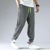 Pantalones Deportivos Elásticos Juveniles Populares de Marca Moda para Hombre con Lazo en la Pierna Pantalones Casuales de Moda de Primavera Color Sólido Pantalones de Nueve Puntos Tipo Holgado