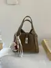 Bolsa de Mão Feminina Estilo Cesta de Design Exclusivo com Toque de Luxo, Bolsa de Ombro, Bolsa Transversal Tipo Balde, Novo Modelo Versátil Outono/Inverno 2025