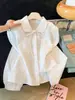 Nueva camisa dulce de estilo francés para mujer de principios de otoño, con un diseño único, manga larga, corte holgado y cuello de muñeca, disponible en blanco y azul
