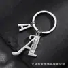 Llavero de estrella hueca con letra para comercio electrónico transfronterizo, llavero personalizado con letra nueva para hombre, accesorios