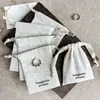 Bolsa de almacenamiento personalizada de lino natural con cordón en beige vintage para tiendas de joyería transfronterizas, bolsa pequeña de tela para empaque de joyería