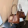 Bolsa Tecida Texturizada Retrô da Moda Nicho Feminina 2026 Nova Versátil Bolsa Transversal Exquisita Super Quente Bolsa de Balde de Mão