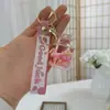Llavero de Botella de Arena Líquida de Dibujos Animados, Pequeños Regalos para Puestos, Accesorios Acrílicos al por Mayor, Colgante Relleno de Aceite, Rasca Gatos Lindo de Regalo