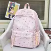 Nova mochila fofa de desenho animado com estrelas transfronteiriça para alunas do ensino fundamental, alto valor estético, simples, leve, bolsa de ombro dupla de grande capacidade