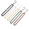 Percha multifuncional de nueve agujeros para colgar ropa en el hogar, ideal para dormitorios, ahorra espacio y es plegable.