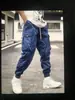 Calça Cargo Plus Size 2023 Primavera Estilo Japonês Marca Tendência Calças Casuais Masculinas Calças com Múltiplos Bolsos de Aba Tendência Jovem Perna Larga Solta com Elástico