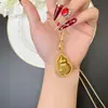 Colar Cruzado Banhado a Ouro Estilo Antigo com Pingente de Cabaça Oca Incrustado com Diamantes Vintage, Joia Versátil de Alto Padrão Novo Estilo Chinês Atacado
